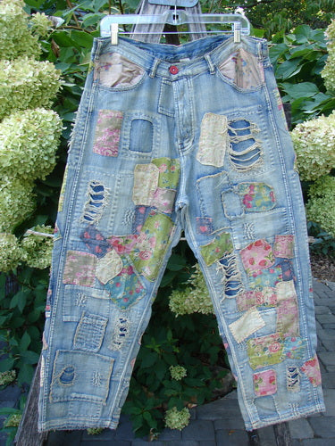 Magnolia Pearl NWT Denim Heavily Patched Miner Jean Garden Patch Washed Indigo OSFA features eclectic floral patches and distressed detailing on light-wash denim, with adjustable button fly and signature MP rear pockets.
