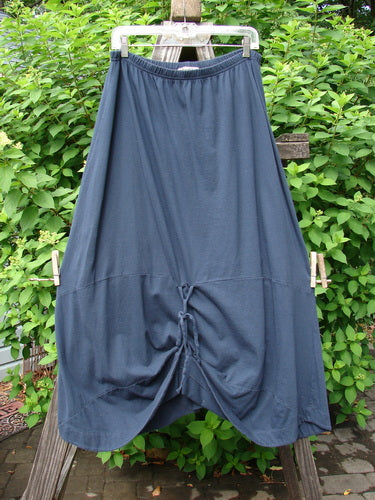 Barclay Shade Skirt Unpainted Navy Size 2: A draping skirt with a full elastic waistband, varying hemline, and extra long cord. Adjustable loops allow for creative styling. Made from organic cotton.