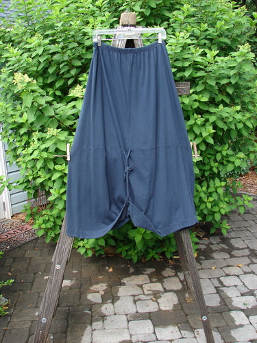Image alt text: Barclay Shade Skirt Unpainted Navy Size 2, a draped organic cotton skirt with an elastic waistband, varying hemline, and adjustable loops.