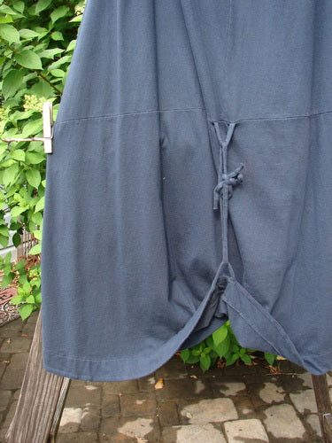 Image alt text: Barclay Shade Skirt on clothesline, made from Organic Cotton, with elastic waistband, varying hemline, and rippie cord.