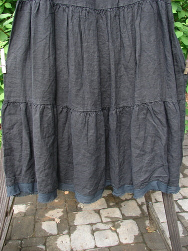 Barclay NWT Linen Fold Over Three Tier Skirt, black, size 2, on a chair. Triple tiers, frayed hem, mid-weight linen. Perfect condition.