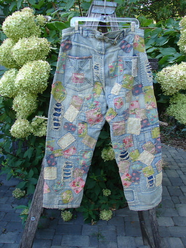 Magnolia Pearl NWT Denim Heavily Patched Miner Jean Garden Patch Washed Indigo OSFA, showcasing vibrant floral and checkered patches, distressed details, adjustable button features, and unique stitchery for a bold, artistic style.