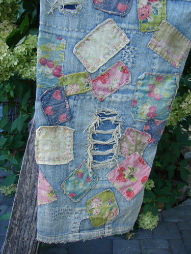 Magnolia Pearl NWT Denim Heavily Patched Miner Jean Garden Patch Washed Indigo OSFA features floral and fruit patches, frayed holes, and hand-stitching, reflecting unique style and craftsmanship of Bluefishfinder.com.