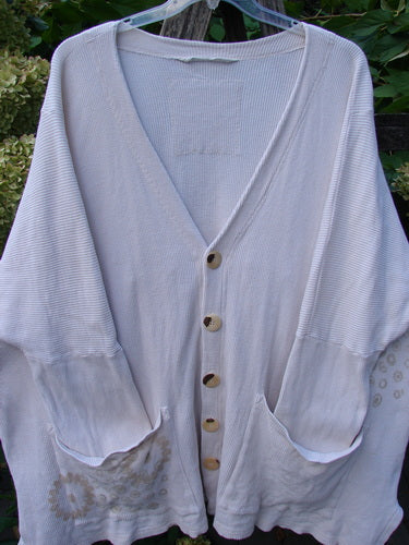 1997 Thermal Voyage Roadside Jacket in Windy Floral Shell, featuring a V-neck, button front, ribbed texture, patch pockets, and faint spots near the hem, embodies BlueFishFinder's vintage, expressive style.