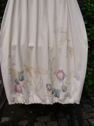 A white towel with a floral design, perfect for the Barclay Little Lace Trim Skirt Garden Folly Crème Size 2.
