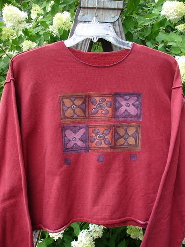 1997 Long Sleeved Boxy Top with Flower Grid Pattern, Size 2. Cotton Fleece, Contrasting Whip Stitching, Drop Shoulders, Double Trio Paint, Vented Sides. Blue Fish Patch.