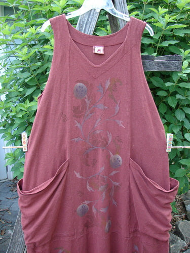 Barclay Cotton Hemp Double Drop Pocket Jumper Curl Vine Cinnabar Size 0 featuring a slightly square V-shaped neckline, oversized wrap pockets, sectional panels, and a banded hemline with a curl vine theme.