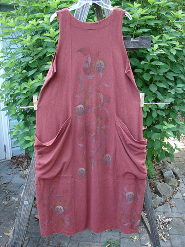 Barclay Cotton Hemp Double Drop Pocket Jumper Curl Vine Cinnabar Size 0 features a slightly square V-neckline, oversized angular wrap pockets, sectional panels, and a banded hemline with a generous curl vine pattern.