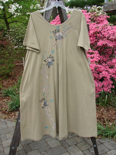 Vintage 1996 Spring Laughter Dress by Seedling: Size 2. Organic cotton with floral and moon pattern. Wide neckline, oversized pockets, pleated back, A-line silhouette. Perfect condition, altered hem for a shorter length.