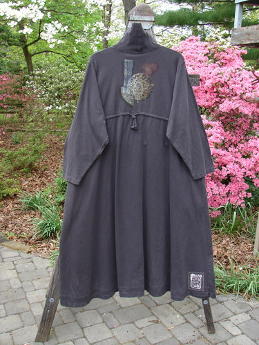 Vintage 1995 Omega Dress Moonflower Bloomsberry Size 2: A black robe with a turtle design, featuring a ribbed turtleneck, drop shoulders, deep pockets, A-line flare, and Moon Flower theme. From BlueFishFinder.com.