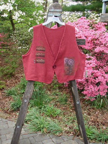 Vintage 1995 Reprocessed Jazz Vest with Lollyflower Theme from Hollyberry, Size 2, on a wooden stand. Straight and angled hemlines, single button closure, deep V neck. Bust 48, Waist 48, Front Length 21, Back Length 19 inches.