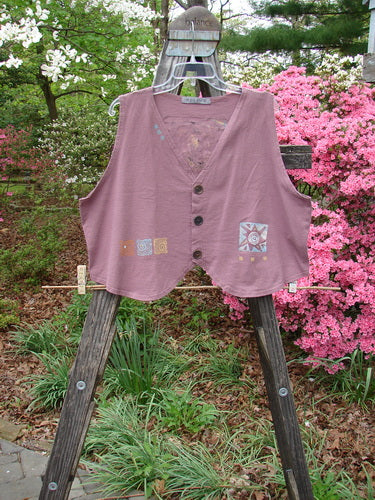 Vintage 1996 Folk Vest Sun Power Petunia Size 2 on wooden stand. Light cotton, shirttail front, matching buttons, V neckline, Blue Fish stamp. Bust 48, Waist 50, Front Length 23, Back Length 19.