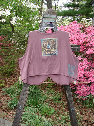 Vintage 1996 Folk Vest Sun Power Petunia Size 2 hanging on a rack, showcasing light organic cotton with unique drape, shirttail front, matching buttons, and Blue Fish stamp. Reflects BlueFishFinder's creative freedom ethos.