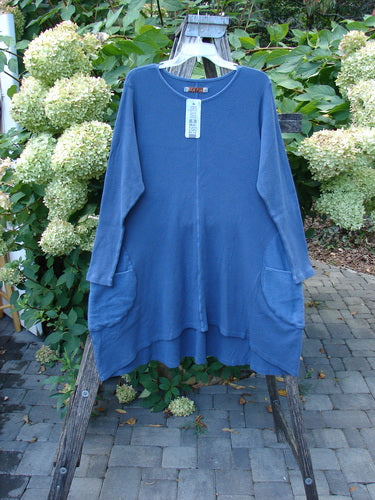 Barclay NWT Thermal Cloud Forest Pocket Tunic Top in Vintage Indigo, displayed on a wooden stand, features long sleeves, round neckline, center seam, large hip pockets, and comes with an infinity wrap.