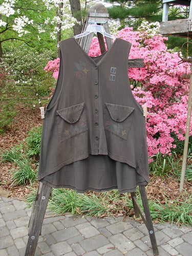Vintage 1994 Love Letter Vest in Edo Black on clothes rack, featuring unique Ginger Pot theme. A-line shape with diagonal pockets and Blue Fish buttons. Reflects Blue FishFinder's creative vintage style.