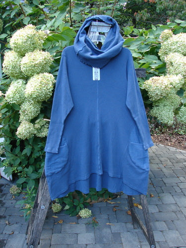 Barclay NWT Thermal Cloud Forest Pocket Tunic Top Unpainted Vintage Indigo Size 1, featuring a draped cowl neck, A-line silhouette, and large front pockets, displayed on a wooden ladder outdoors.