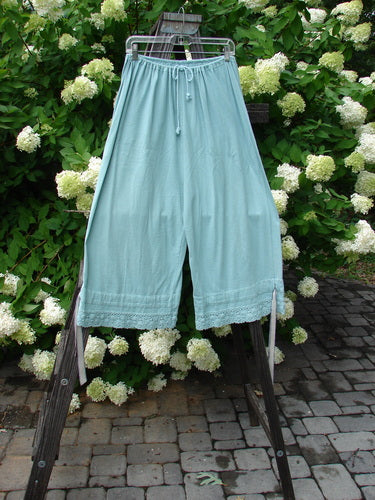 1992 Pantaloon Unpainted Blue Tourmaline OSFA: Midweight cotton pants with antique lace and silk ribbon accents, featuring a full drawcord waistline, wide swingy lowers, and a double paneled lower ribbon band.