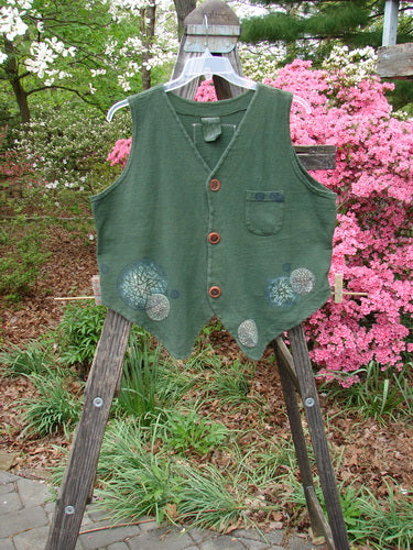 Vintage 1995 Reprocessed Drawing Room Vest featuring Star Spin design in Green Tea. Ceramic button front, tailored draw cord back, front pocket, and Blue Fish signature patch. Perfect condition, crafted from thick cotton.