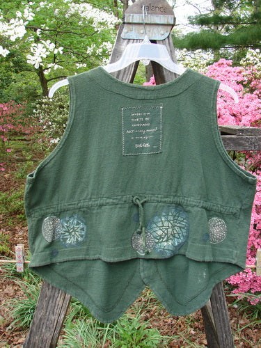 Vintage 1995 Reprocessed Drawing Room Vest featuring a Star Spin theme in Green Tea. Ceramic button front, tailored drawcord back, front pocket, and Blue Fish patch. Made from thick cotton. From BlueFishFinder.com.
