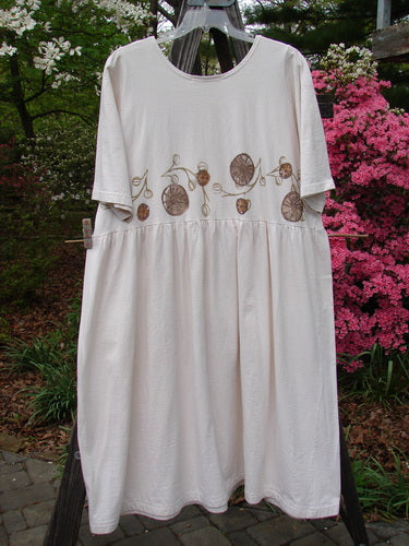 Vintage 1994 Flower Garden Dress with Garden Trail motif, altered to Size 2 in Ecru. Mid Weight Cotton Jersey, Scooped Neckline, Drop Waist Seam, Generous Folds, Two Button Side Accent. Bust 52, Waist 54, Hips 70, Length 48.