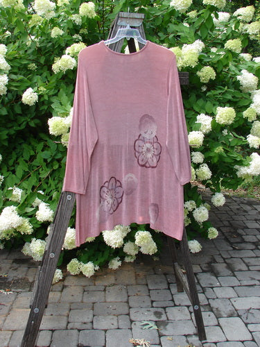 1999 Camillia Top with giant floral design on a pink shirt. Swingy, lined shape with varying hemline. Perfect condition. Size 2.