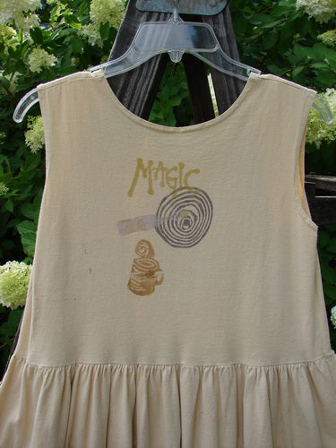 1995 KIDS Cutie Jumper Magic Teacup Glint Size 2: A white dress with a graphic of a magic teacup. Perfect for kids or smaller adults.