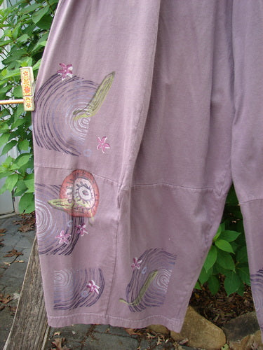Barclay 4 Square Pant Spin Wind Dusty Plum Size 0, showcasing a 3D diamond drape design from knee down, mid-weight organic cotton with uneven fade, elastic waistband, and unique artistic paint pattern.