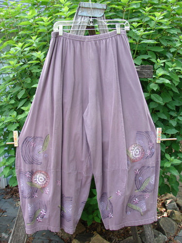 Barclay 4 Square Pant Spin Wind Dusty Plum Size 0, displayed on a clothesline, showcases a unique 3D diamond drape from knee down with artistic paint design and elastic waistband.