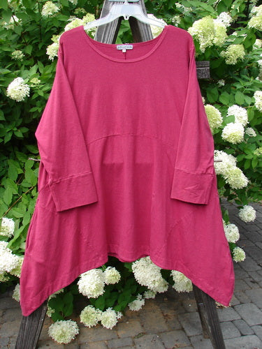 A pink Barclay Cotton Lycra Igloo Tunic Dress on a clothes rack. Features include a rounded neckline, drop side pockets, and a sweeping hemline. Size 2.
