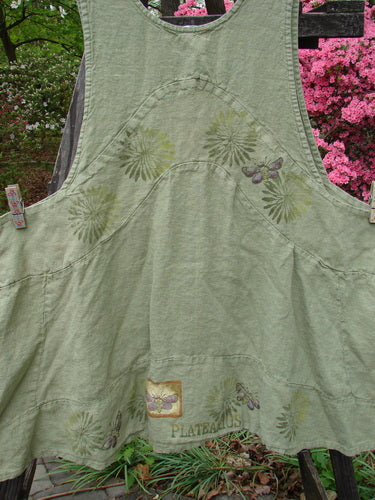 1998 Botanicals Leafhopper Jumper apron featuring butterfly design on heavy linen. Nature-themed with double-paneled waist, bib-style neckline, and unique paint details. From BlueFishFinder's vintage collection.