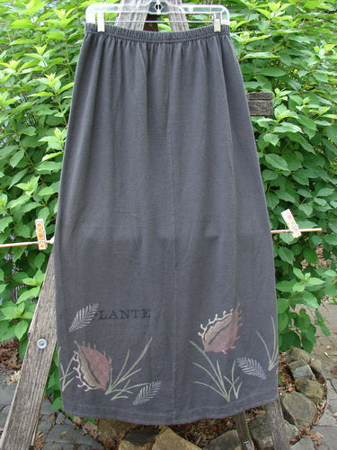 1998 Botanicals Corolla Skirt Plante Vine Raven Size 1 features a grey, full elastic waistband with an upward scooped hemline, showcasing a botanical vine pattern. From BlueFishFinder's vintage collection.