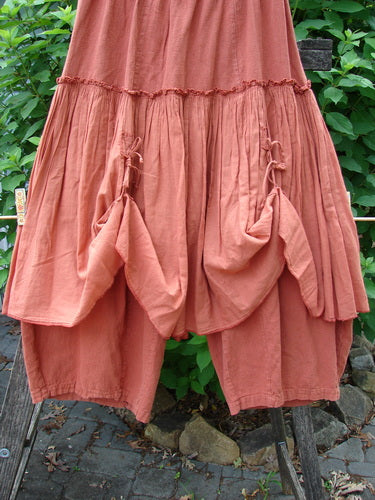 Barclay Hemp Linen Batiste Fusion Pant Skirt Autumn Harvest Size 0 features a unique layered design with triangular patches, dual ties, and a slightly billowy shape, highlighting its artistic craftsmanship.