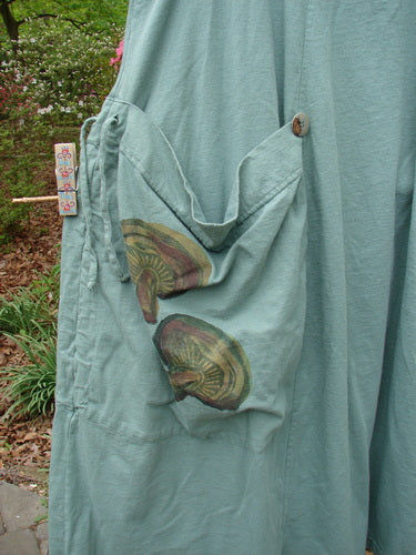 Vintage Blue Fish 1998 Harvest Pinafore Organic Garden Kale Size 1, featuring drawcord gathers, oversized painted pockets, six sectional panels, original buttons, and a veggie theme. A unique and versatile smock top from Bluefishfinder.com.