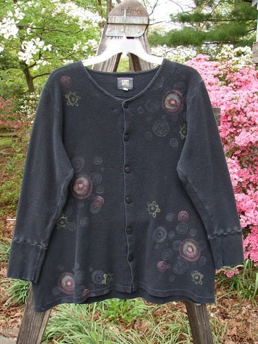 Vintage 2000 Thermal Lu Top featuring a Pinwheel design in Black. Ribbed cuffs, rubberized buttons, and a slight A-line shape. Perfect for creative expression. Size 2. From BlueFishFinder.