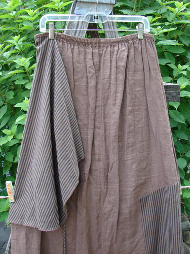 Barclay Linen Every Way Apron Skirt Stripe Mocha Size 0 features a full elastic waist, striped apron layer, and sectional panels, showcasing intricate stitchery and a slightly flared hem.