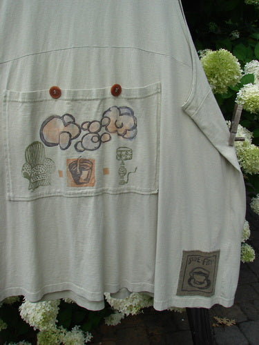 1994 Fishing Vest Magic Garden Aloe OSFA: A white shirt with drawings of a person's shirt, featuring a deep V-shaped neckline and three front painted pockets.