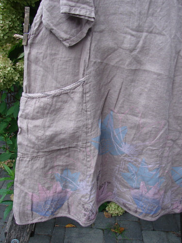 Barclay NWT Linen Calotype Stack Pocket Dress Grow Garden Oriel Size 0 features a light-beige linen with a side pocket, decorative hem, and three-quarter sleeves, hanging outdoors, epitomizing Bluefishfinder.com's vintage-inspired aesthetics.