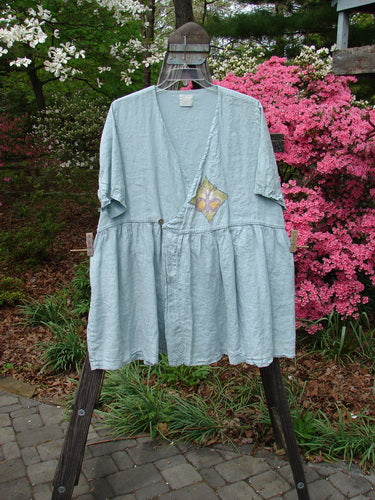 Vintage 1999 Linen Adjustable Wrap Dress featuring a Butterfly design, from BlueFishFinder.com. Cross Over Front, Empire Waistline, Flouncy Skirt, Pearl Buttons, Butterfly Print Wrap. Fits Bust 42-56, Waist 42-58, Hips 65-85. Length 37.