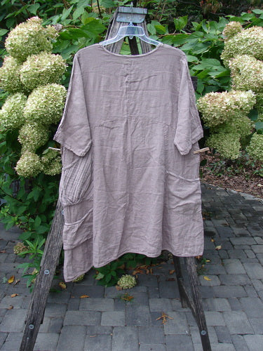 Barclay NWT Linen Calotype Stack Pocket Dress Grow Garden Oriel Size 0, displayed on a hanger, features three-quarter sleeves, a curved empire waist, and front pockets, embodying Bluefishfinder.com's vintage-inspired style.