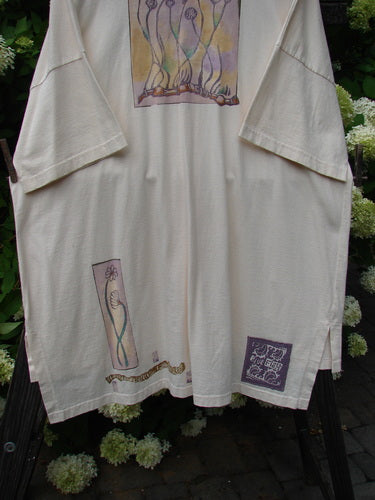 A 1997 Island Beach Jacket in Powder, featuring a sea sprig theme with tall flower sprigs and a Blue Fish patch. Made from organic cotton, it has generous drop shoulders, oversized textured buttons, and a varying hemline. The jacket is boxy yet longer in shape, with super vented sides and a shirttail rear hemline. Bust 62, waist 62, hips 62, front length 32, and back length 36 inches.