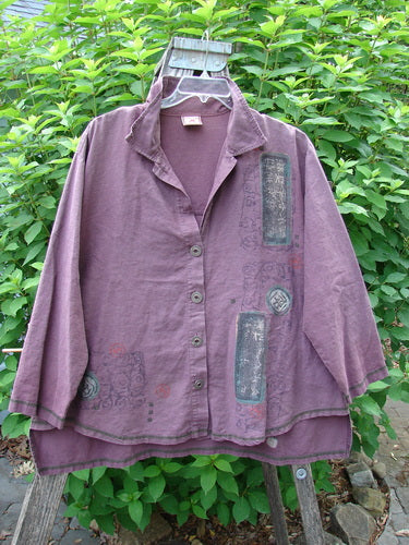 Barclay Hemp Cotton Metal Button Workshirt with Asian Script in Plum Wine, displayed outdoors, showcasing exterior contrasting stitchery, full metal buttons, shirttail hemline, and a stand-up collar, highlighting the Bluefishfinder vintage style.