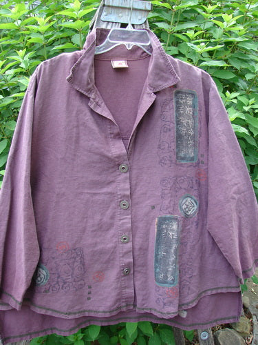 Barclay Hemp Cotton Metal Button Workshirt features a circular design, contrasting stitching, metal buttons, shirttail hemline, stand-up collar, and Asian script theme, reflecting Bluefishfinder.com's vintage-inspired collection.