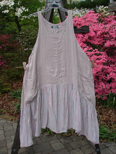 Barclay Gauze Batiste Peasant Jumper in Unpainted Stripe Mallow, Size 2, hanging on a clothesline outdoors, embodying Blue Fish's vintage charm and creative freedom for women.