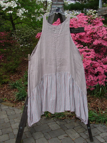 Barclay Gauze Batiste Peasant Jumper in Unpainted Stripe Mallow, Size 2, hanging on a clothesline outdoors. Features a sweeping batiste lower, scoop neckline, varying hemline, and wrap pockets. Vintage Blue Fish Clothing from BlueFishFinder.com.
