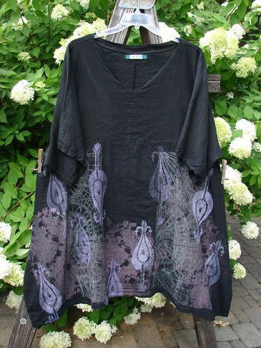 Barclay Linen Viscose Vented Urchin Dress - A black dress with purple designs and peacock feathers. Three-quarter length sleeves, V-neckline, and empire waist. Fluttering fan theme. Size 2.
