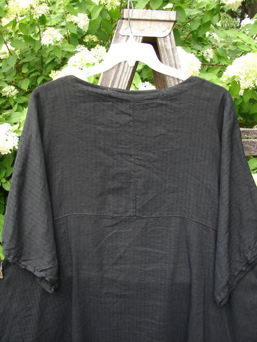 Barclay Linen Viscose Vented Urchin Dress, size 2, in Stripe Black. Three-quarter length sleeves, V-shaped neckline, and empire waist seam. Sweet tiny vented sides and a subtle black and gray back stripe.