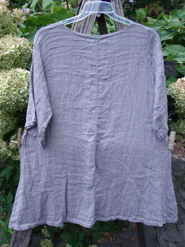 Barclay NWT Linen Simple Tunic Top Wing Mountain Opal Mauve Size 1 with roll-tab three-quarter sleeves, rounded neckline, and A-line shape, draped outdoors on a wooden ladder.