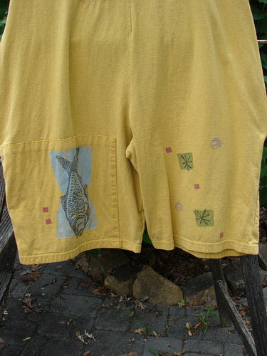 1991 Farmer Brown Overall Pant Jumper Vintage Fish Goldenrod OSFA features yellow shorts with fish and squares, showcasing generous shoulder straps, front painted pocket, and unique vintage design details.