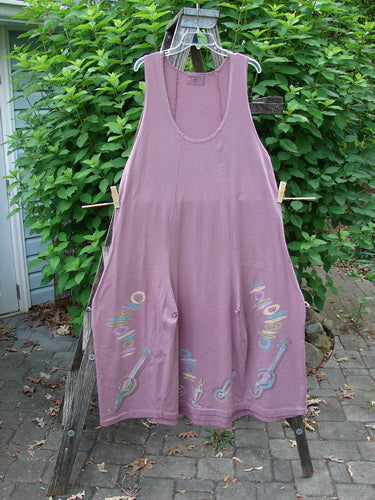 Barclay Constellation Jumper Music Festival Dusty Plum Size 1 features a deeply scooped neckline, widening lower sweep, pointed hem accents, button rippie gather, and sectional vertical panels, showcasing unique design elements.