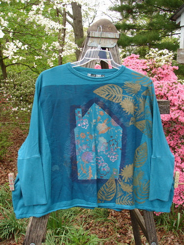 Barclay Crop Rib Sleeve Top Woods Home Aqua OSFA: A blue shirt with gold designs, dolman sleeves, crop length, wide lower hem, and ribbed sleeve accents. Vintage Blue Fish Clothing by Jennifer Barclay.